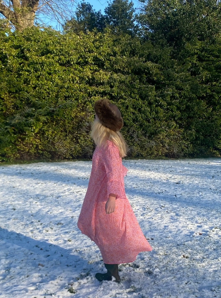 Sunni is an ultra luxurious, organic pure cotton nightie with bell sleeve in pink glow with orange. It is invariably mistaken for silk.   Extremely comfortable and light and feels beautiful to sleep in - the moment you put it on, it feels heavenly.   Elegant, ethereal and so pretty with a pretty neckline and gorgeous bell sleeve  The model is usually a size 8 but seen here in our size 12 sample   Superb workmanship and has been produced in a happy workshop well known to us under excellent working conditions