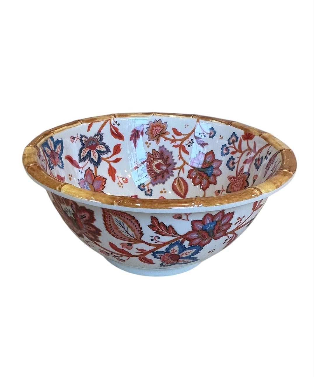 Decorative ceramic bowl with Indain floral patterns on a white background